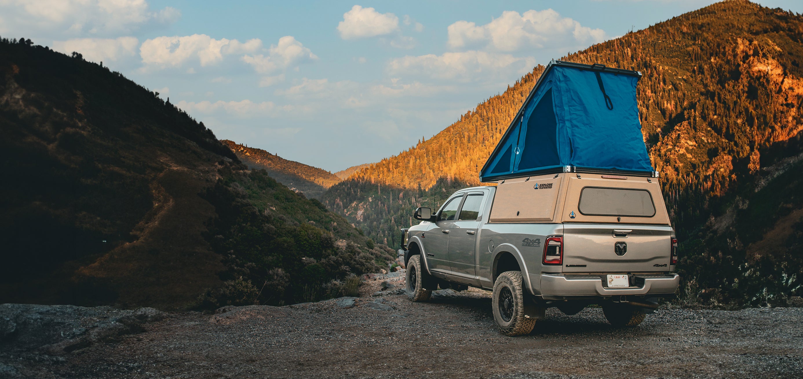 explore elevated Dodge Ram truck top camper right